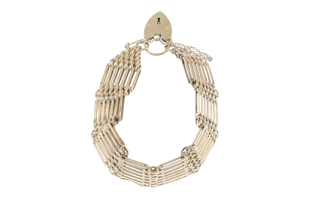 A 9ct gold gate bracelet. Designed as a series of alternating gate and brick links, to the tapered - Image 2 of 2