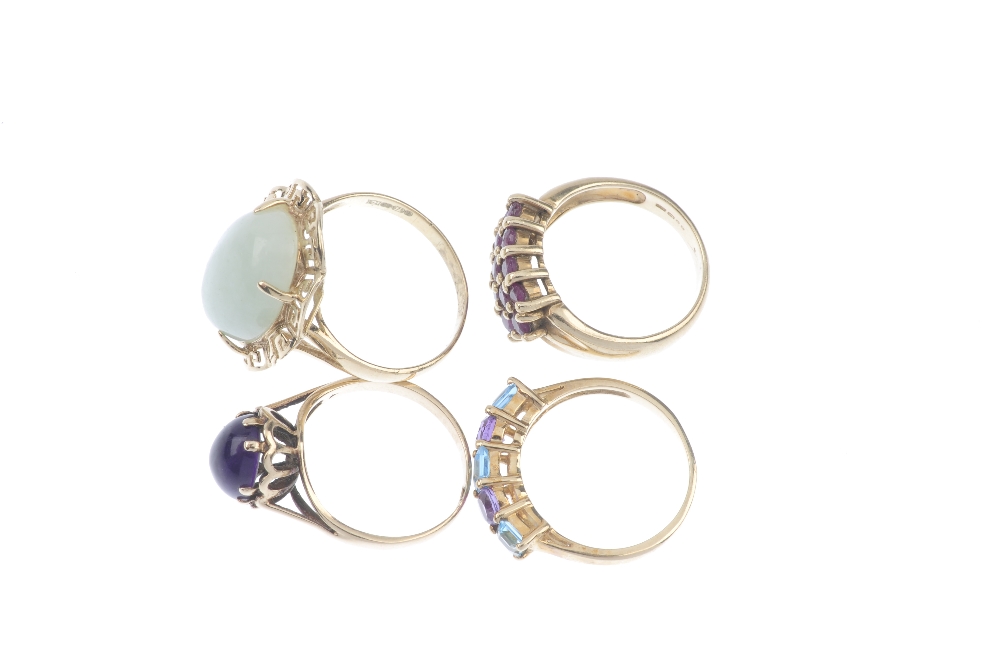 A selection of four gem-set dress rings. To include an amethyst and blue topaz five-stone ring, a - Image 3 of 3