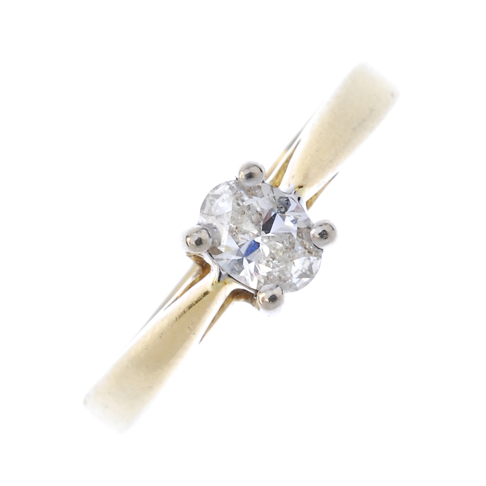 An 18ct gold diamond single-stone ring. The oval-shape diamond, to the tapered band. Diamond