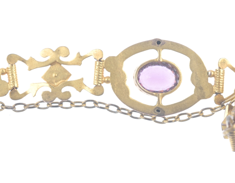 An early 20th century gold garnet-topped-doublet and split pearl bracelet. Of scrolling design, - Image 4 of 4