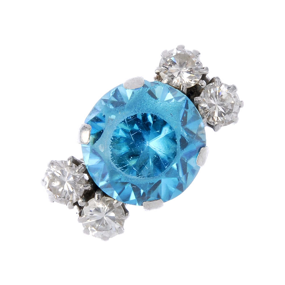 A mid 20th century 18ct gold and platinum gem-set ring. The circular-shape zircon, to the