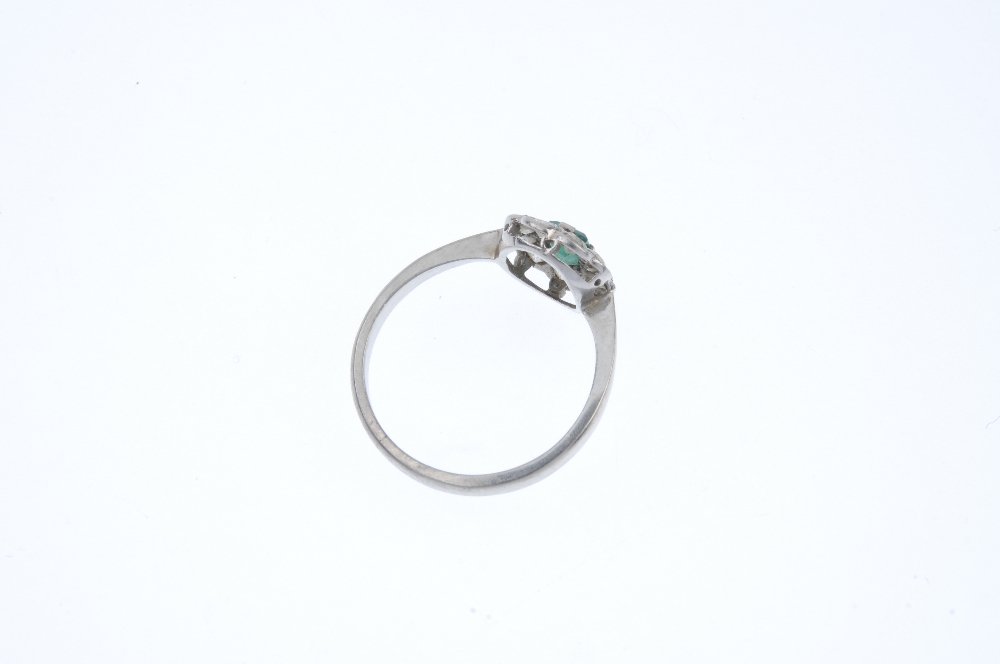 A mid 20th century platinum emerald and diamond cluster ring. The rectangular-shape emerald, - Image 4 of 4