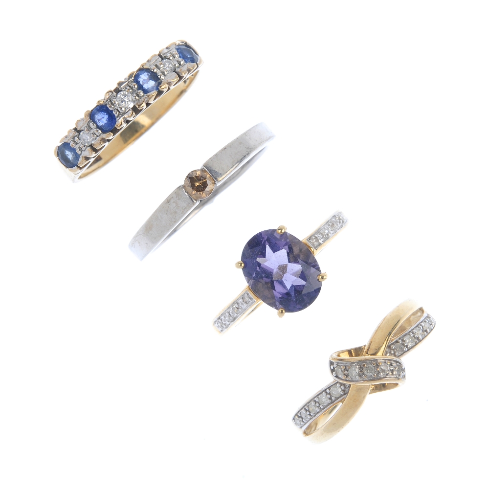 A selection of four 9ct gold diamond and gem-set rings. To include a diamond stylised knot ring, a