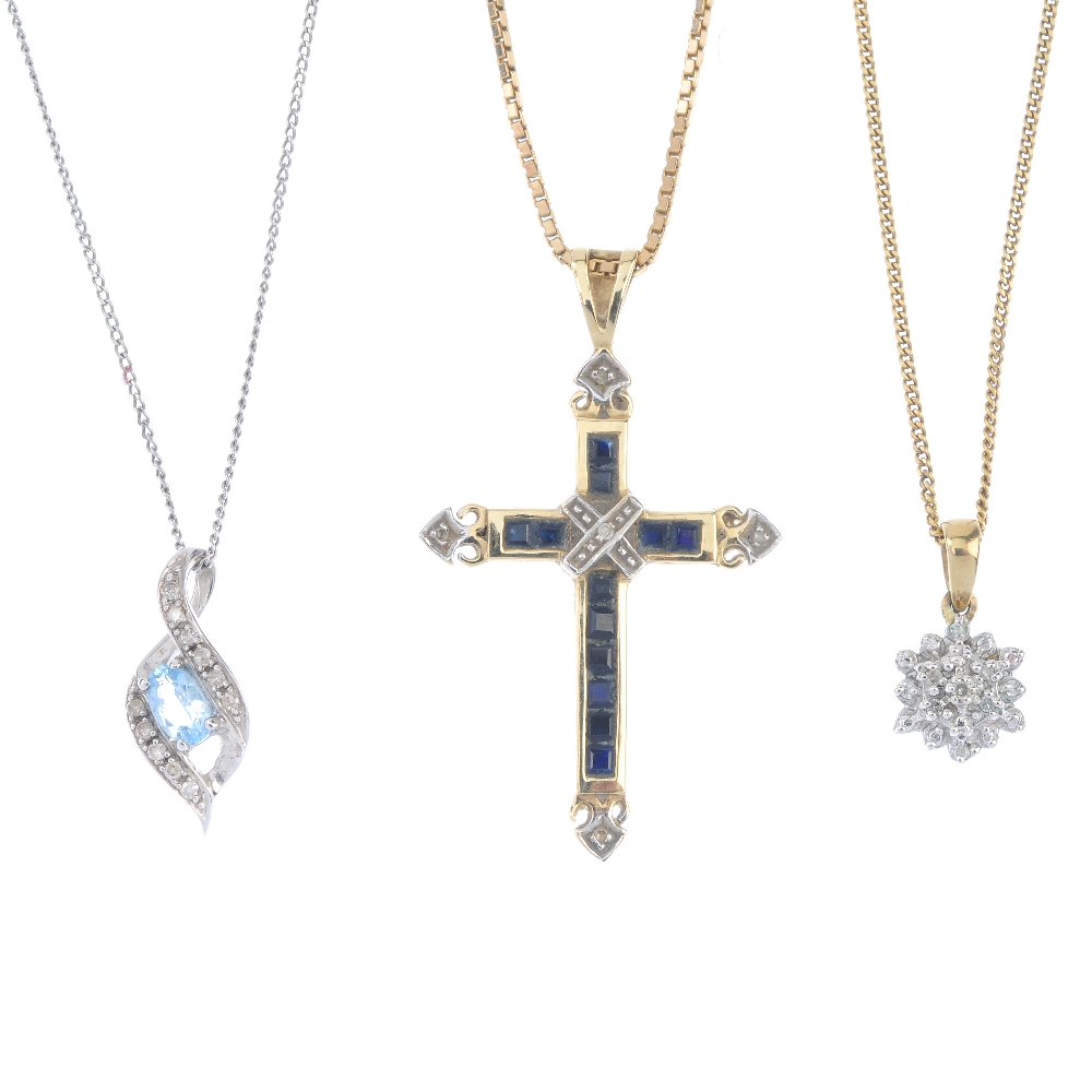 A selection of three diamond and gem-set pendants. To include a 9ct gold sapphire and diamond cross,