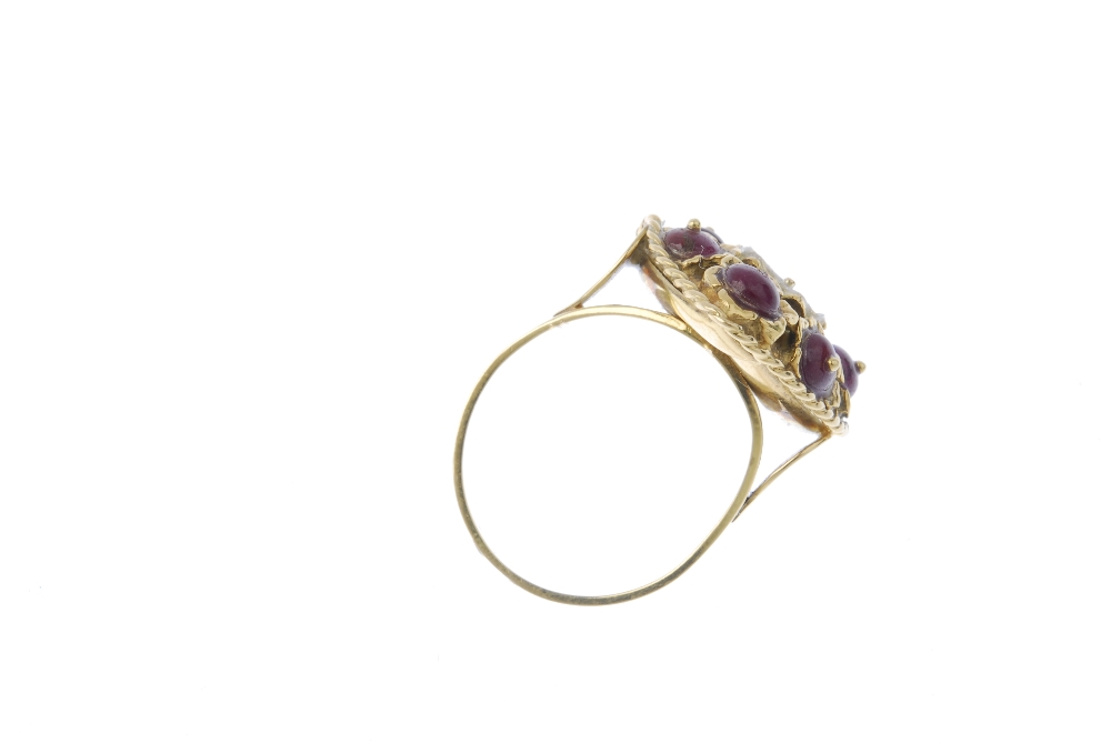 A ruby dress ring. The ruby beads set within rope-twist surround, to the plain band. Central stone - Image 4 of 4