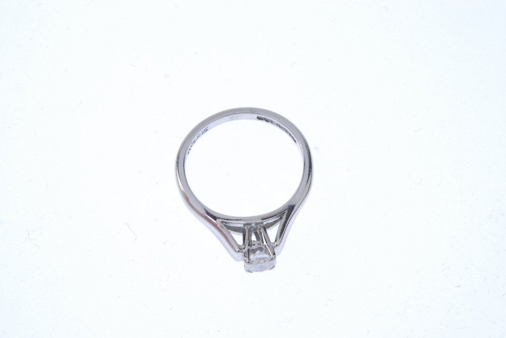 A gold diamond single-stone ring. The brilliant-cut diamond, to the wide concave shoulders and plain - Image 2 of 4
