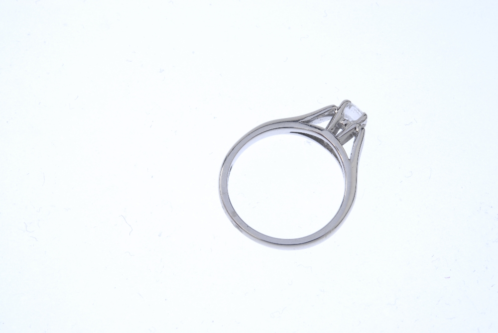 A gold diamond single-stone ring. The brilliant-cut diamond, to the wide concave shoulders and plain - Image 4 of 4