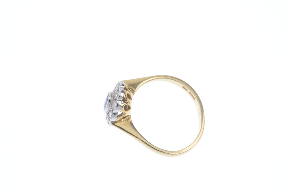 An 18ct gold sapphire and diamond cluster ring. The oval-shape sapphire, within a brilliant-cut - Image 3 of 4