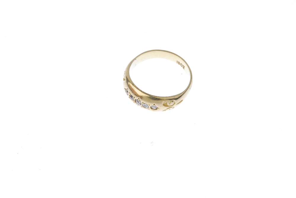 An early 20th century 18ct gold diamond five-stone ring. The single-cut diamond line, with scrolling - Image 2 of 4