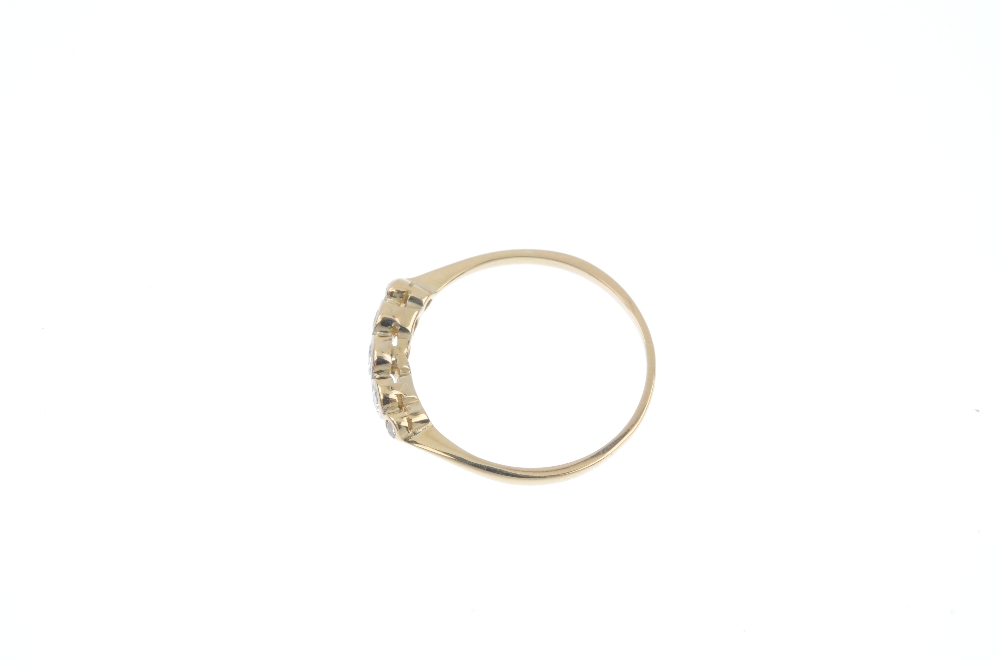 A mid 20th century 18ct gold diamond ring. The graduated vari-cut diamond collet line, to the - Image 3 of 4