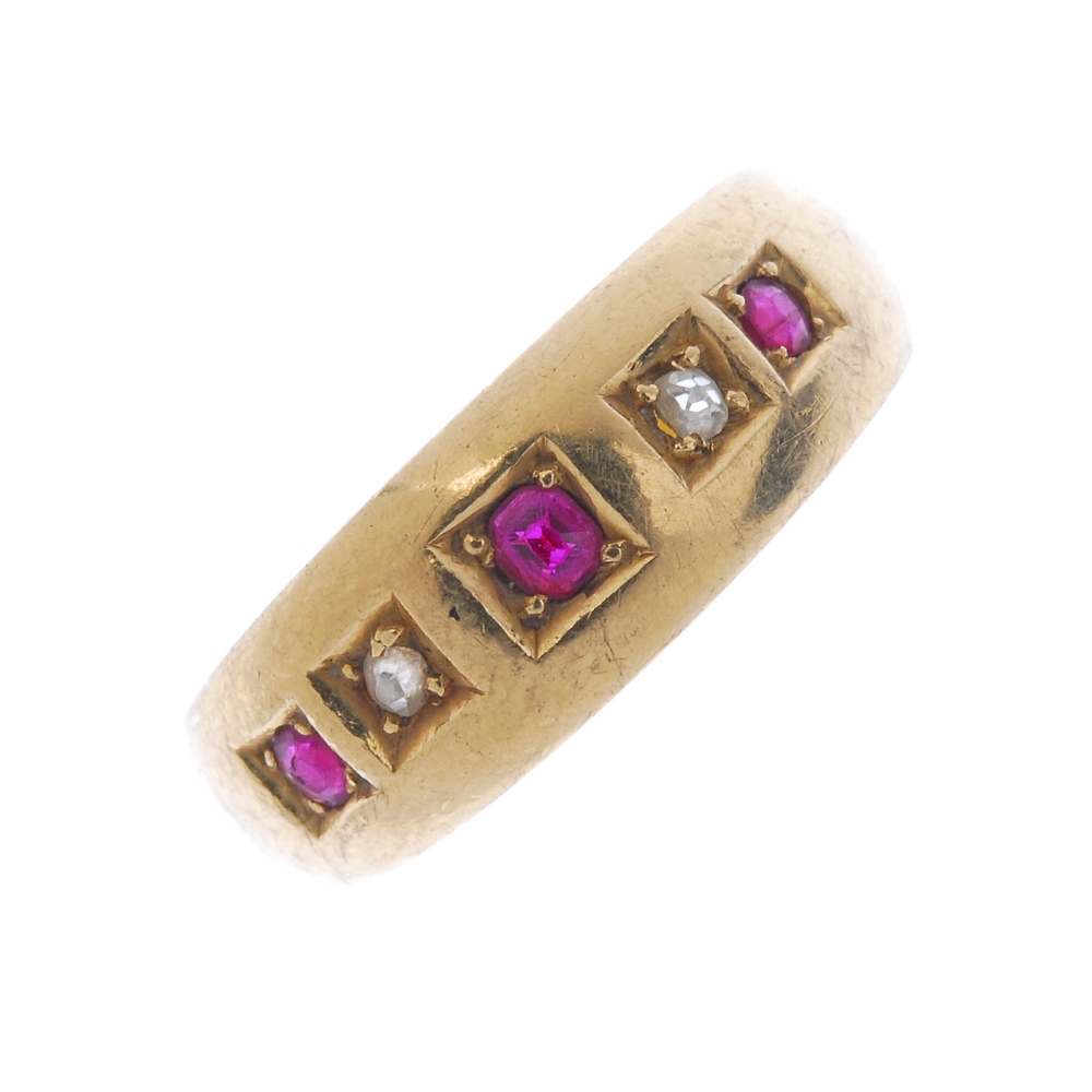 A Victorian 18ct gold ruby and diamond five-stone ring. The circular-shape ruby and single-cut