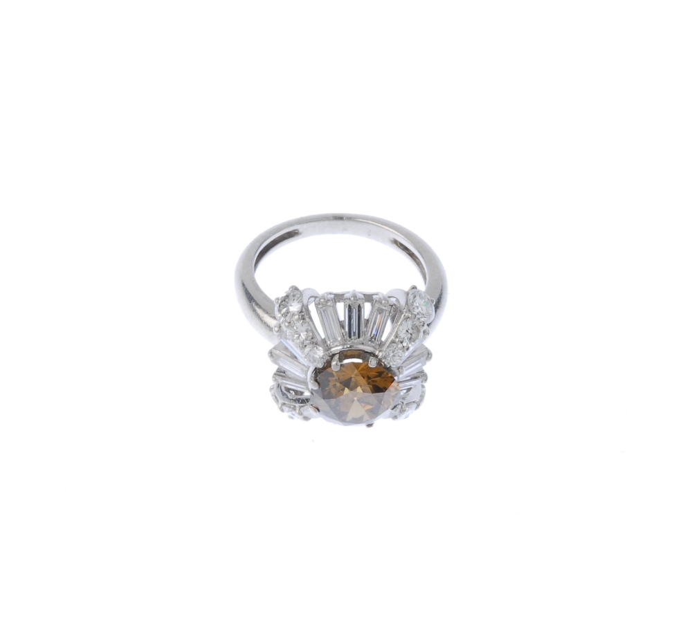 (541162-3-A) A coloured diamond and diamond dress ring. The circular-cut 'brown' diamond, within a - Image 4 of 4