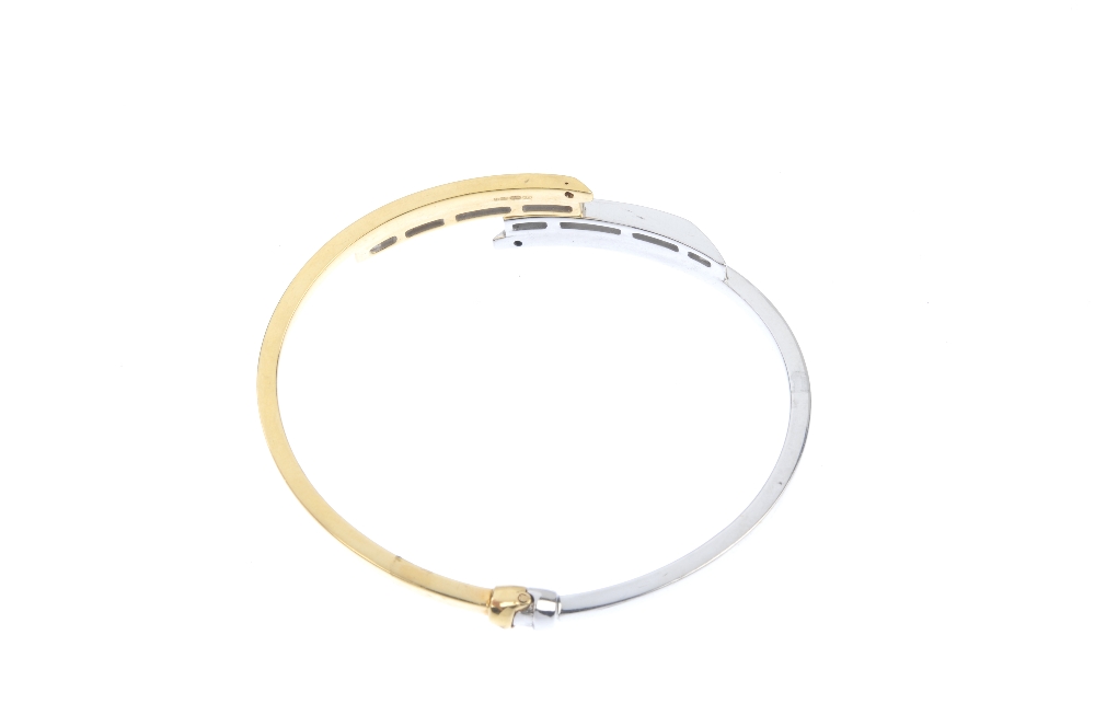 An 18ct gold diamond crossover bangle. Of asymmetric design, the square-shape diamond lines, to - Image 2 of 2