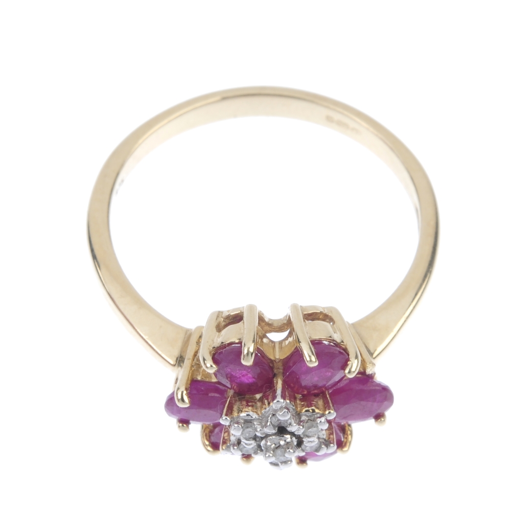 A 9ct gold diamond and ruby floral cluster ring. The single-cut diamond stepped cluster, within an - Image 2 of 4