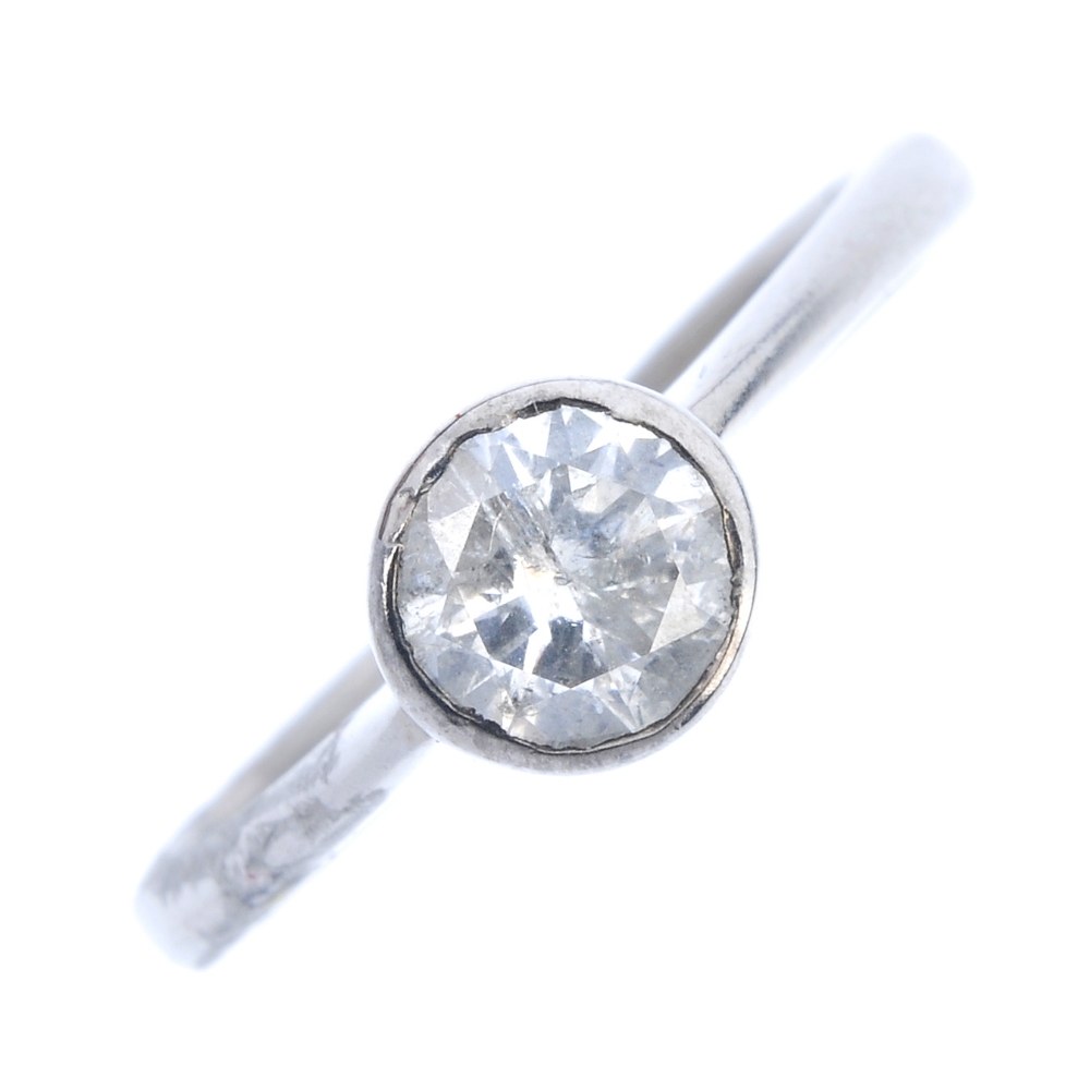 An 18ct gold diamond single-stone ring. The circular-cut diamond collet, to the plain band.