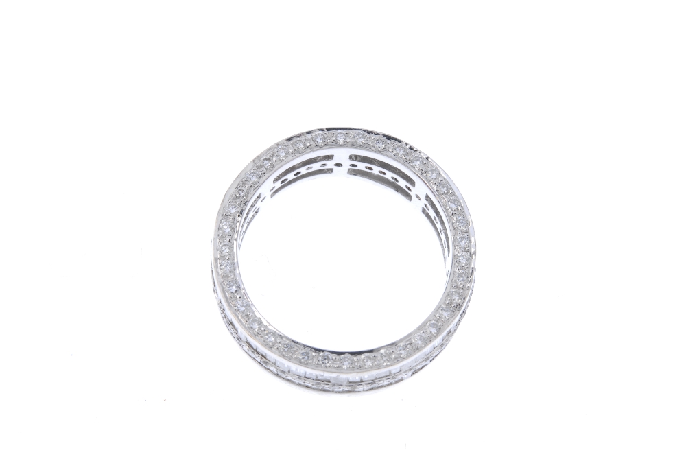 A diamond full-circle eternity ring. The alternating baguette and brilliant-cut diamond lines, to - Image 3 of 3