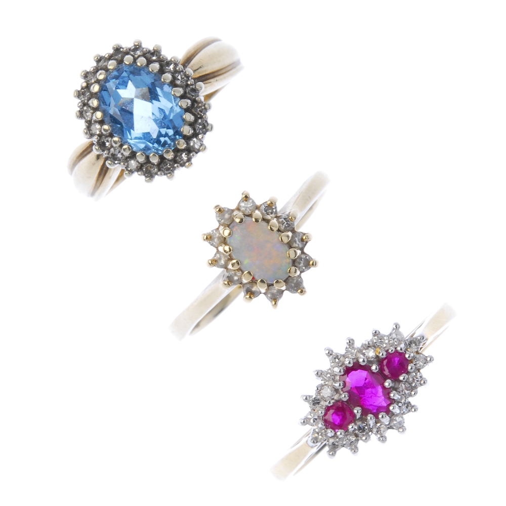 A selection of three 9ct gold diamond and gem-set cluster rings. To include a ruby and diamond ring,