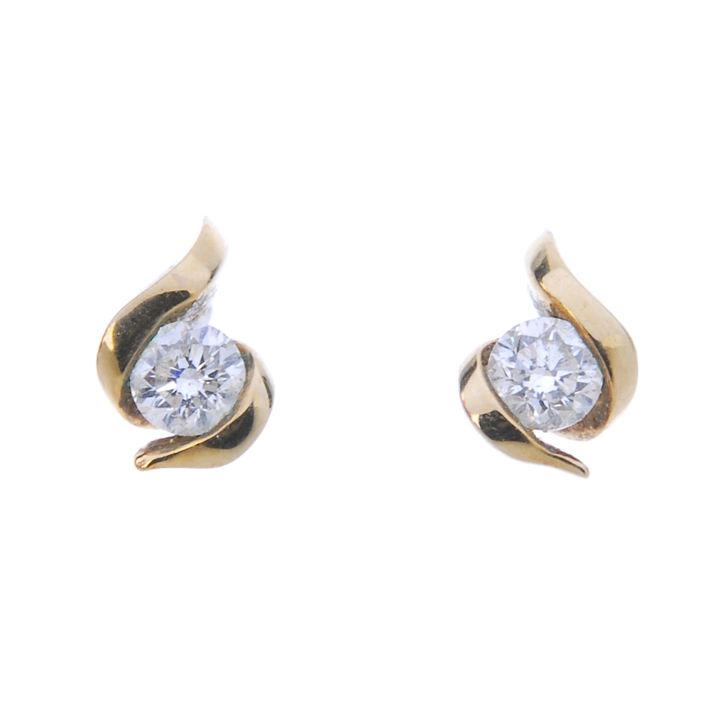 A selection of diamond jewellery. To include a diamond cross, a pair of 9ct gold diamond ear