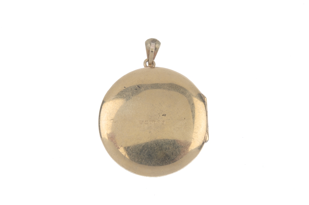 A 1970s 9ct gold locket. Of circular outline, the foliate front, with plain back and tapered - Image 2 of 2