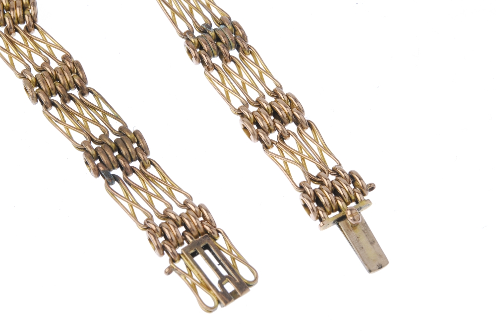 An early 20th century 9ct gold bracelet. Designed as a series of fancy gate-links and brick-links, - Image 2 of 3