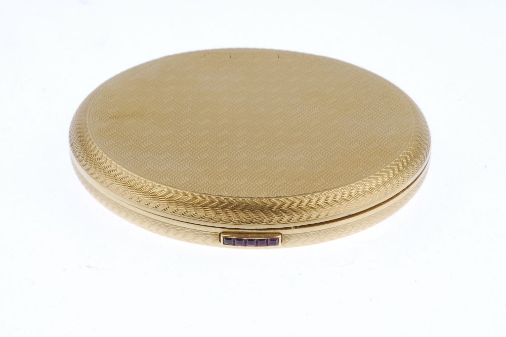 (543021-1-A) A 1950s 18ct gold powder compact. The circular-shape, engine-turned case, with - Image 2 of 3