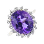 A 9ct gold amethyst and diamond floral cluster ring. The oval-shape amethyst, within a single-cut
