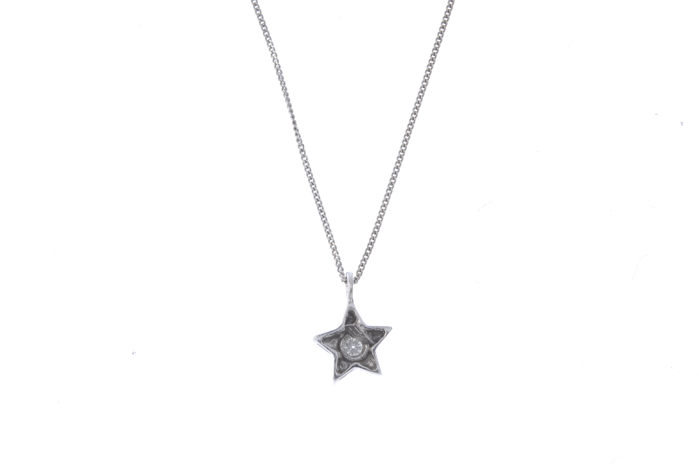 A diamond star pendant. The brilliant-cut diamond, within a star surround, suspended from an 18ct - Image 2 of 3