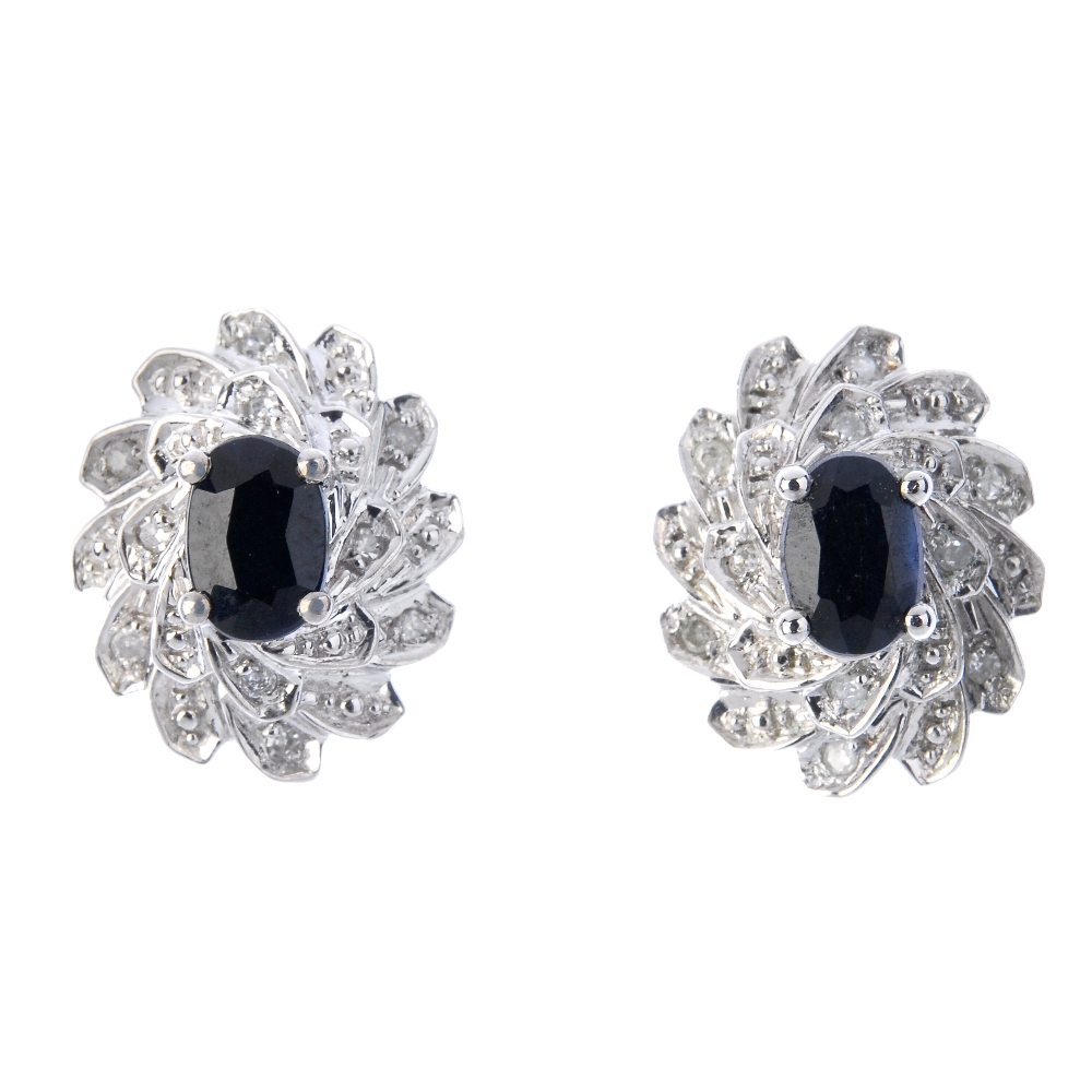 A selection of four pairs diamond and gem-set earrings. To include two pairs of oval-shape