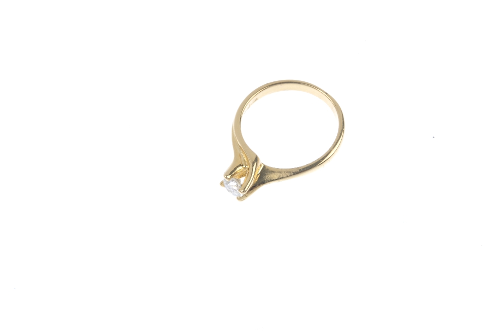 An 18ct gold diamond single-stone ring. The brilliant-cut diamond, to the spiral gallery and - Image 2 of 4