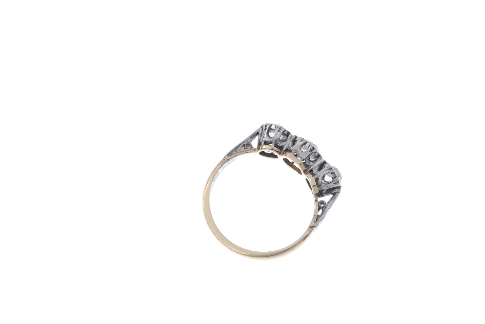 A mid 20th century 18ct gold diamond three-stone ring. The graduated old-cut diamond line, to the - Image 4 of 4