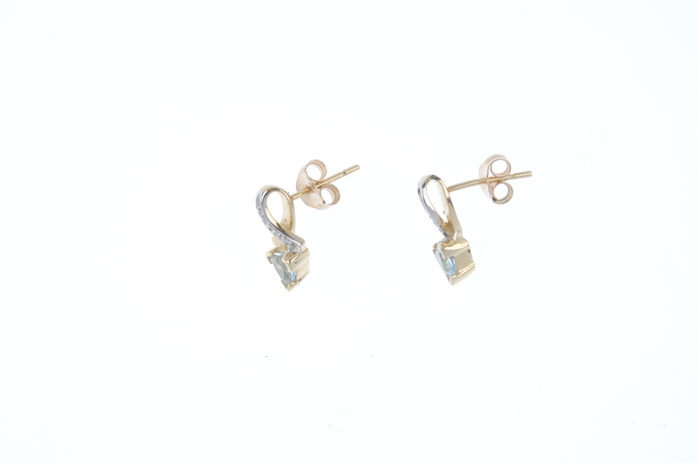 A pair of topaz and diamond ear pendants. Each designed as a triangular-shape topaz, to the single- - Image 2 of 2