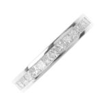 An 18ct gold diamond full-circle eternity ring. The square-shape diamond line, within a channel-
