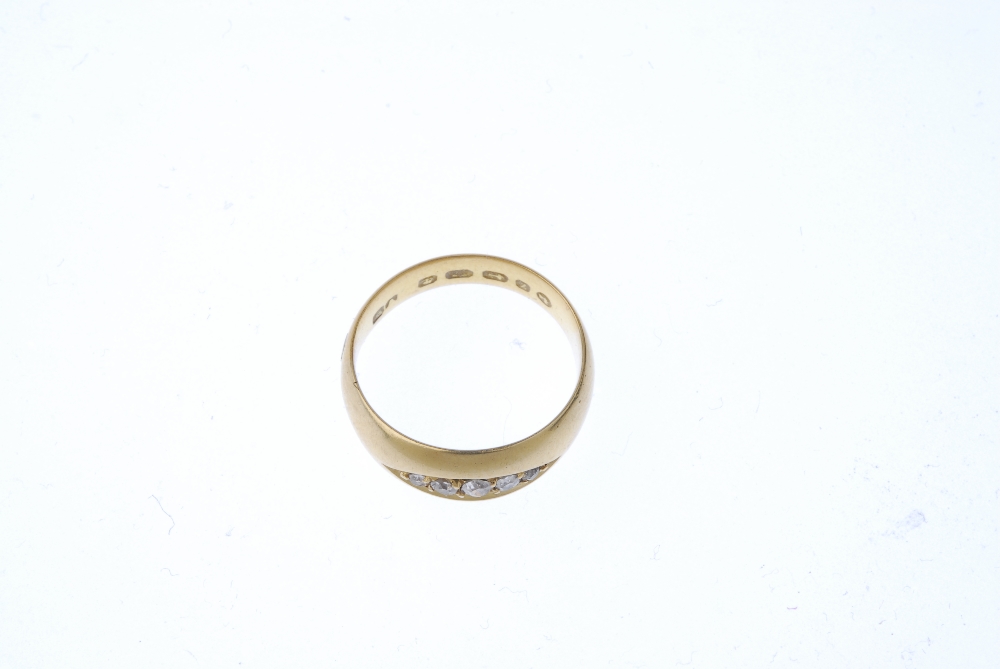 A mid-Victorian 22ct gold diamond five-stone ring. The graduated old-cut diamond line, inset to - Image 2 of 3