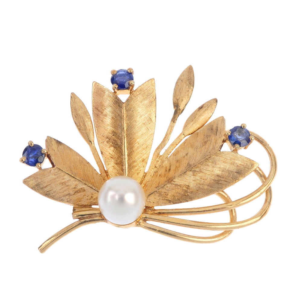 A cultured pearl and sapphire floral brooch. Designed as a stylised floral spray, with cultured