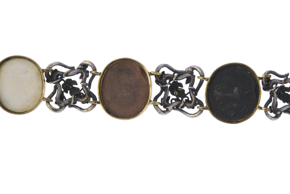 A lava cameo bracelet. Comprising four oval-shape lava cameo panels, of varying tones depicting - Image 2 of 3