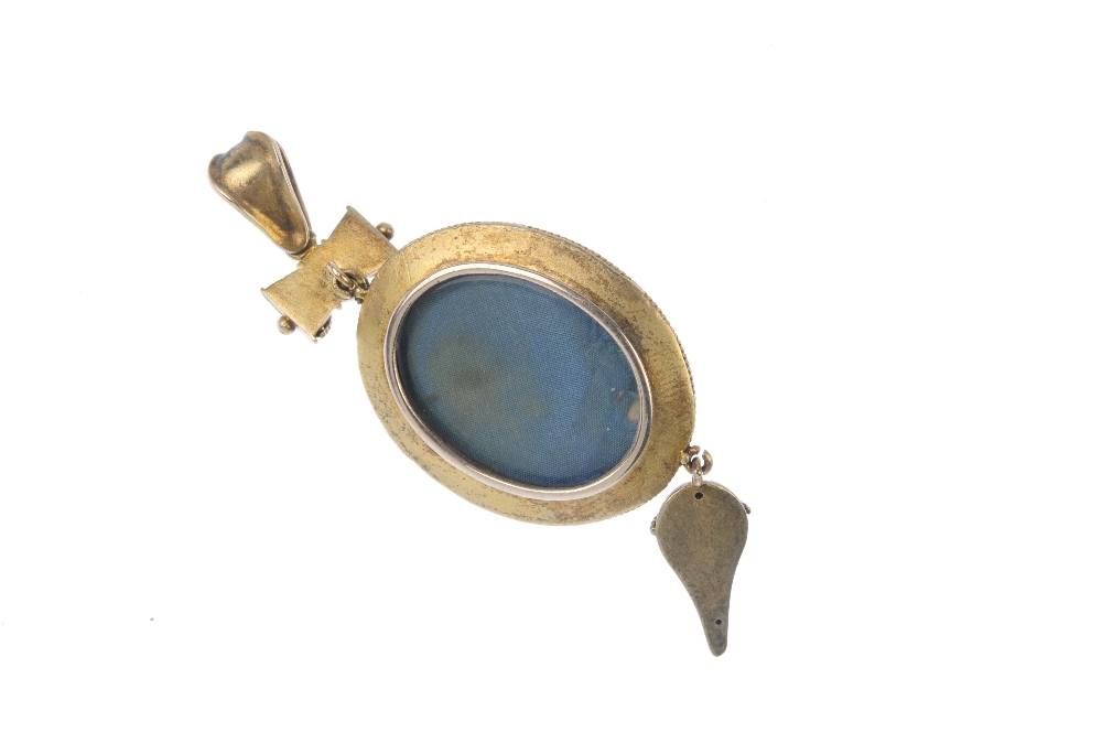 A late Victorian gold plated and enamel pendant. The split pearl and blue enamel oval-shape - Image 2 of 2