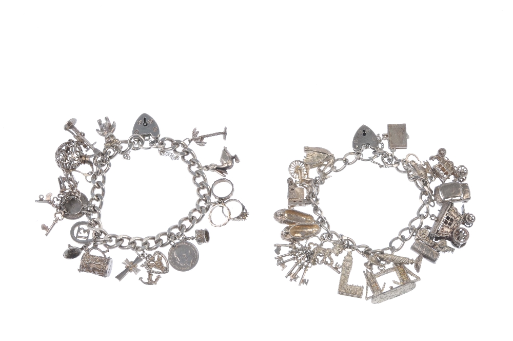 Two charm bracelets. Suspending a total of twenty-eight charms, to include a palm tree, a bunch of - Image 2 of 2