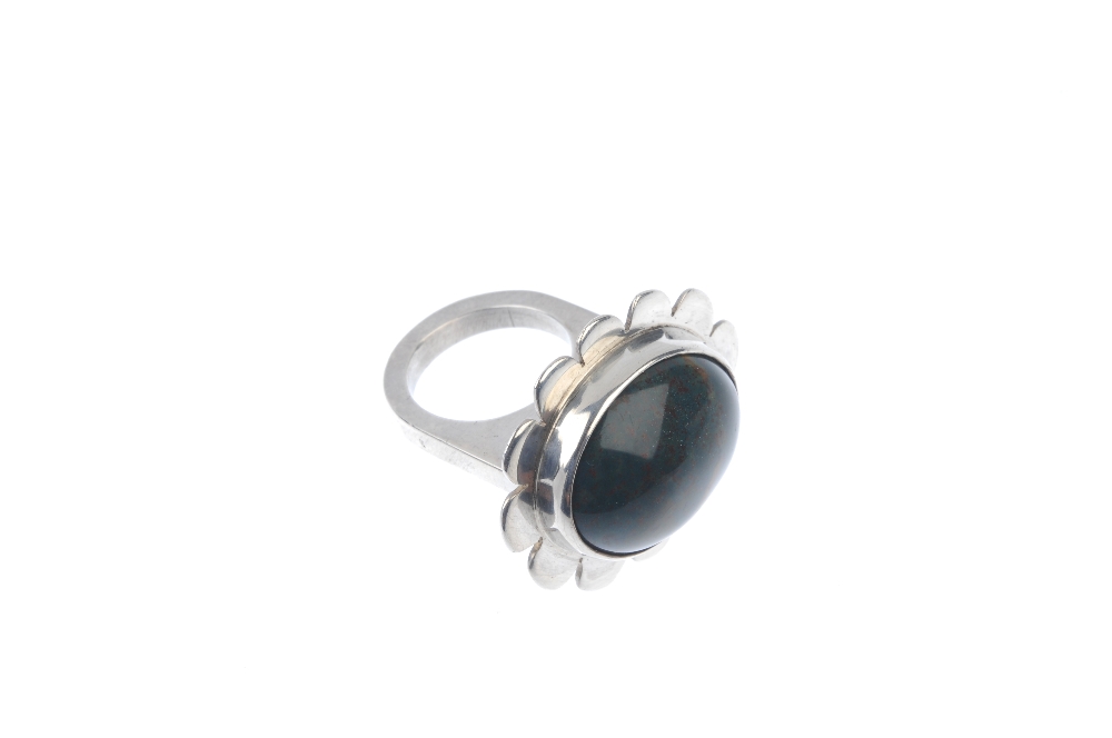 BERIT PETRINI - a bloodstone ring. Designed as an oval bloodstone collet-set to the scalloped - Image 3 of 4