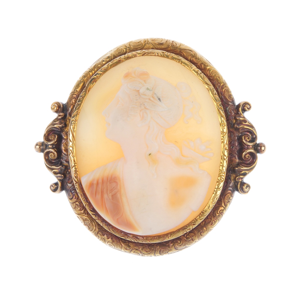 A mid 19th century mounted shell 18ct gold cameo. The oval-shape shell cameo, depicting Flora, to