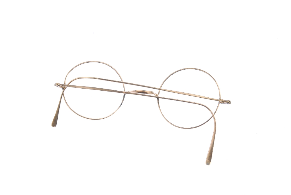 A pair of early 20th century 9ct gold spectacle frames. Lenses deficient. One lense frame broken. - Image 2 of 2