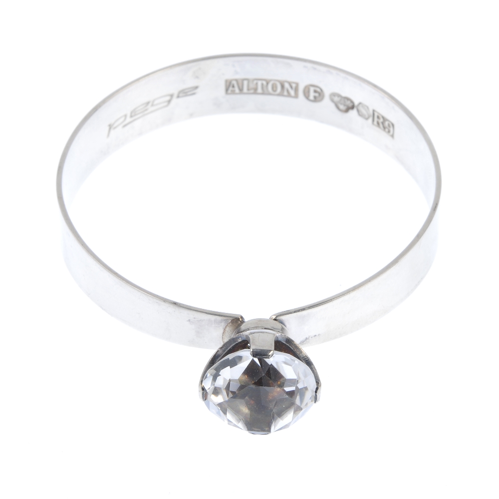 ALTON - a 1960s bangle set with rock crystal. Designed as a plain tapered bangle to the four-claw