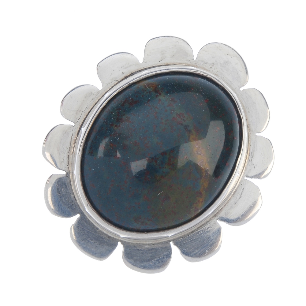 BERIT PETRINI - a bloodstone ring. Designed as an oval bloodstone collet-set to the scalloped
