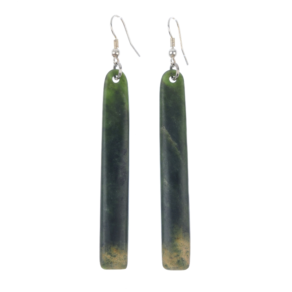 A pair of New Zealand jade ear pendants carved by Paddy Cooper. Each of elongated rectangular-