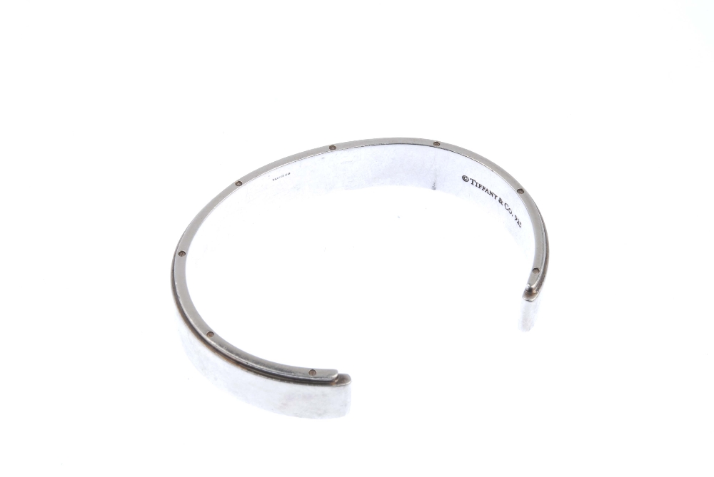 TIFFANY & CO. - a bangle. The open bangle with screw detail to the edges and plain front. Signed - Image 2 of 2