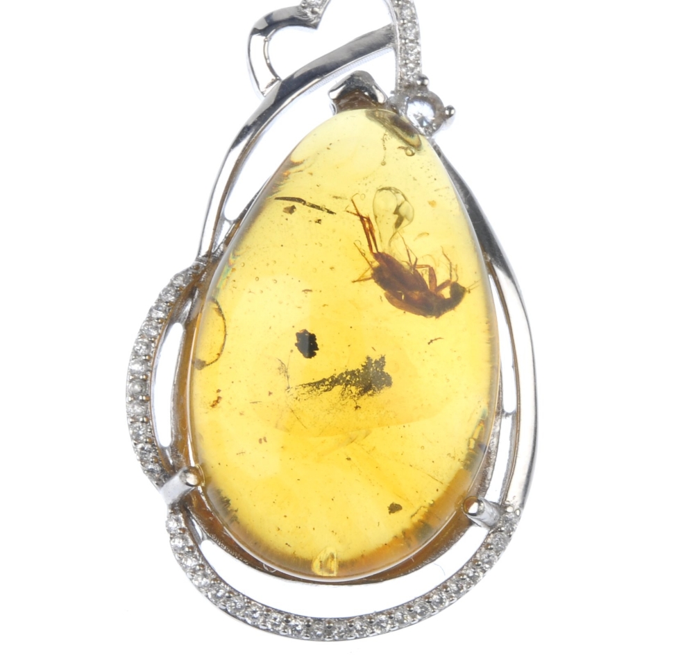 A natural Burmese amber pendant with inclusion. The pear-shape amber cabochon, with clearly - Image 2 of 3