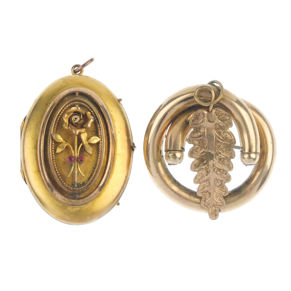 A late 19th century paste locket and a brooch. The oval-shape locket, with applied rose detail and