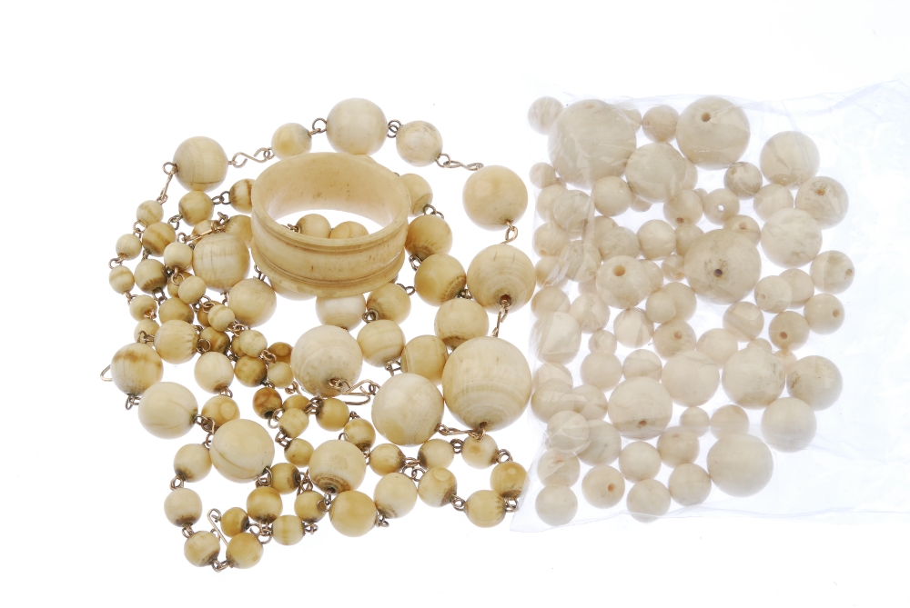 A selection of ivory and a bone napkin ring. To include three graduated ivory bead necklaces, a - Image 2 of 2