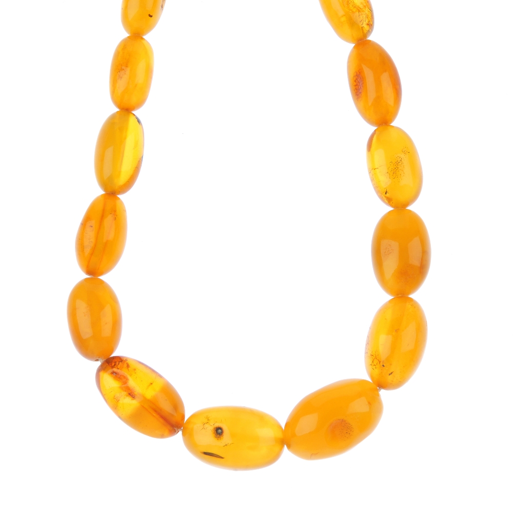 A natural amber necklace. Comprising forty-two graduated beads measuring 1.4 to 2.8cms. Length