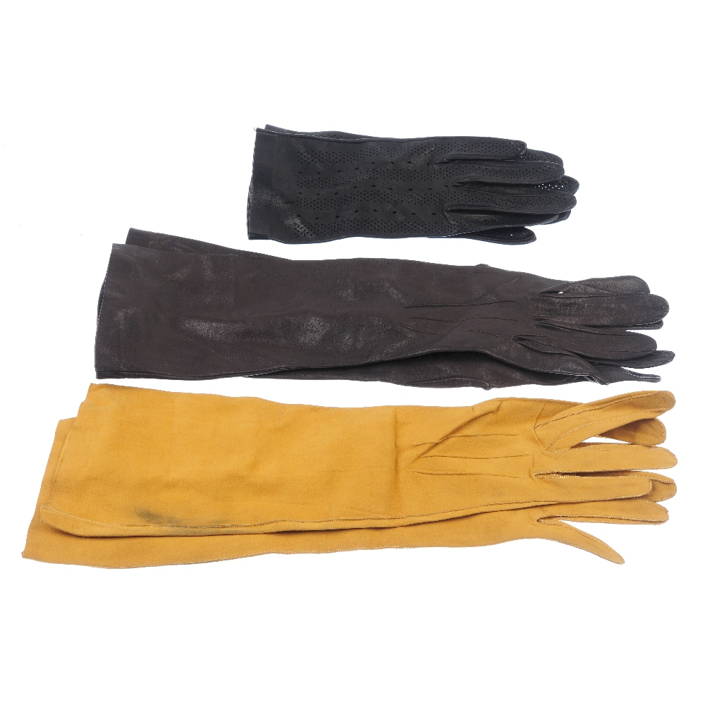 Fourteen pairs of gloves. The majority of gloves made from leather and suede in a variety of colours