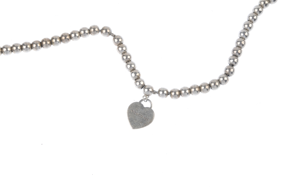 TIFFANY & CO. - a 'Return to Tiffany' bracelet. The miniature heart-shaped charm with 'Return to - Image 2 of 3